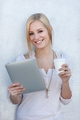 A woman holding a tablet